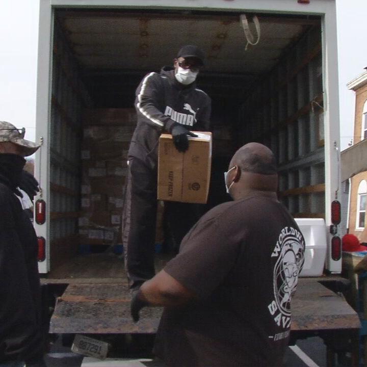 Community Connections Group giving boxes of chicken to 400 families